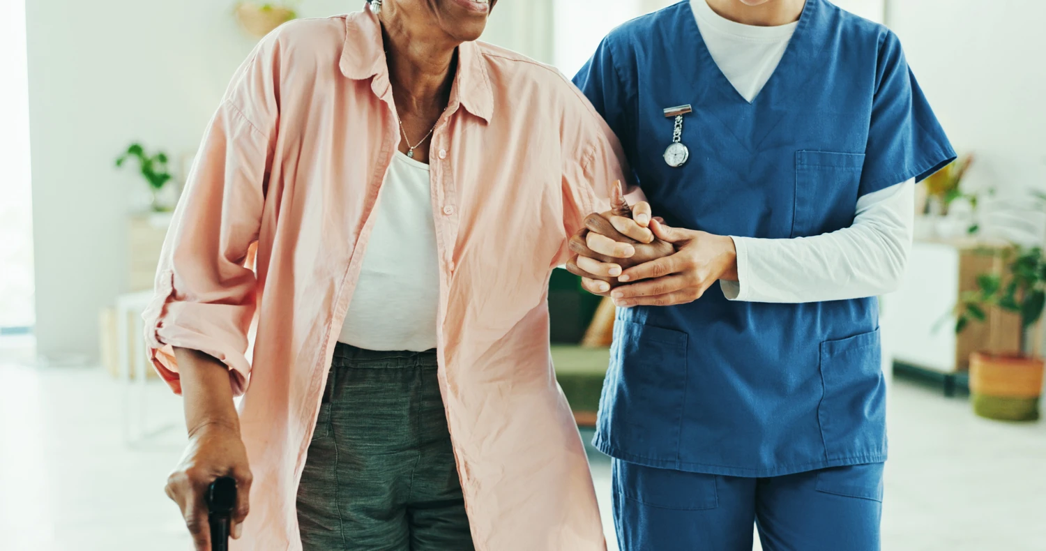 Physiotherapy, holding hands and help with walking stick for support, recovery and guide at home.